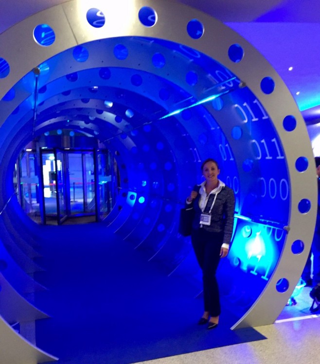 Francesca Spidalieri stands in a decorative archway at the 2015 Global Conference on CyberSpace