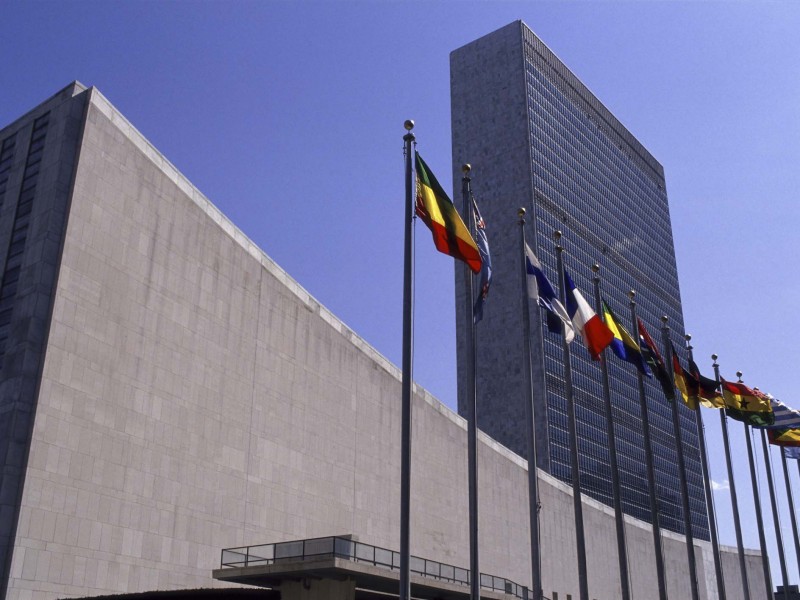 Image of the front of the United Nations headquarters in New York City.