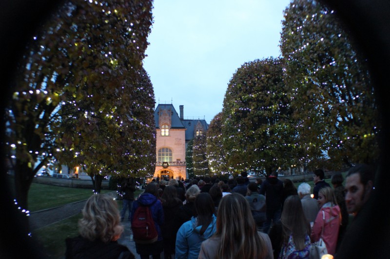 Students file through the gates and into the building of Ochre Court with candles in hand after attending the gate-opening ceremony for the Jubilee Year of Mercy.