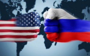 Image featuring fists painted with the American and Russian flags about to clash into one another upon a world map.