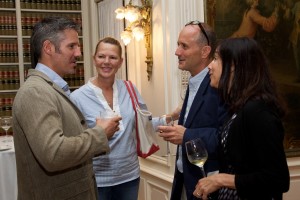 Pell Center prize winner Javier Manzano speaks with audience members at the reception following his acceptance speech.