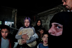 Pell Center Prize winner Javier Manzano's stunning photograph of a Syrian family that is reacting to an air strike after having collected their bread ration.