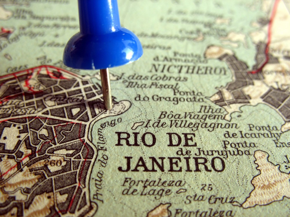Close up of a political map of Brazil focused on Rio de Janeiro with a blue push pin.