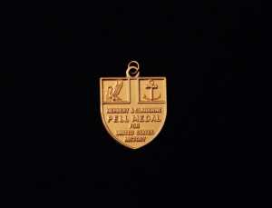 Image of Herbert and Claiborne Pell medal for United States History on a black background.