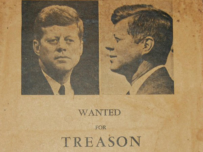 Flyer of what appear to be JFK's mug shots above text that reads "wanted for treason"