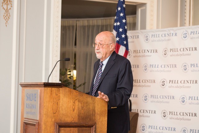 Mario DiNunzio, professor emeritus at Providence College, stands at the Salve Regina podium.