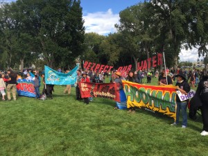 People protest North Dakota Acess Pipeline with large signs