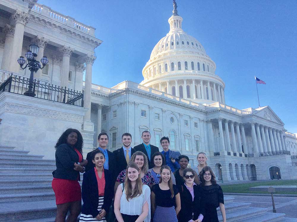 Nuala Pell Leadership Fellows pose on steps of the capitol building